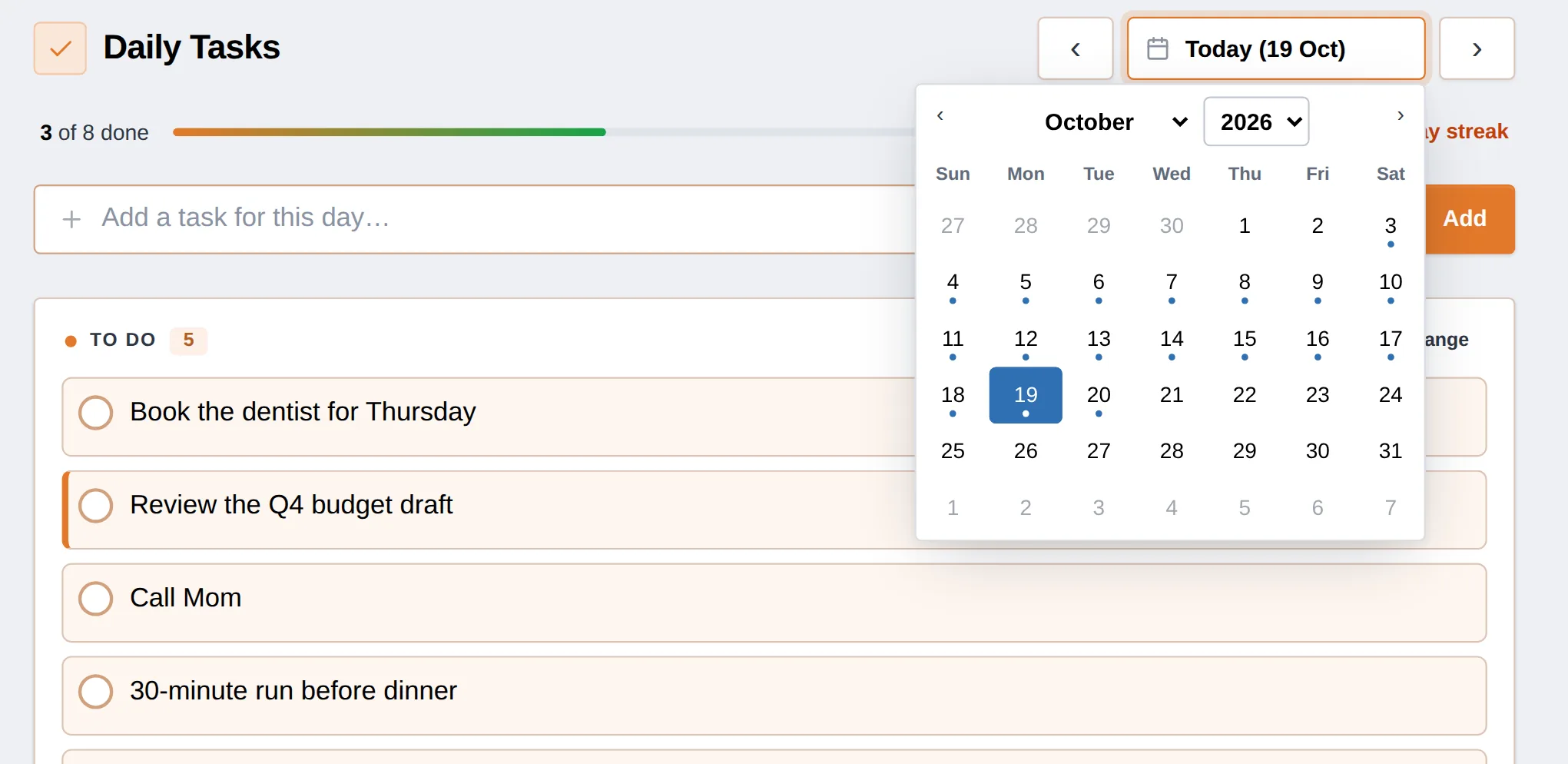 The calendar on the Daily Tasks screen, with dots under the days that have tasks